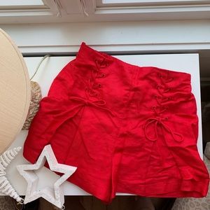 high waisted tied red shorts